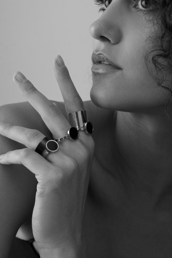 Minimalist stainless steel ring with a black stone on a silver band 2