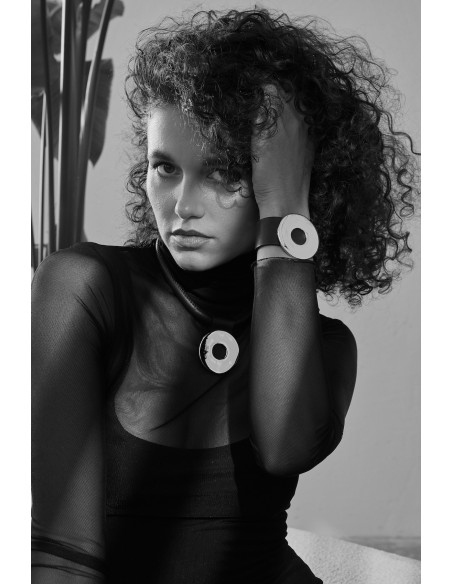 Black leather choker with matte stainless steel circle pendant and magnetic clasp