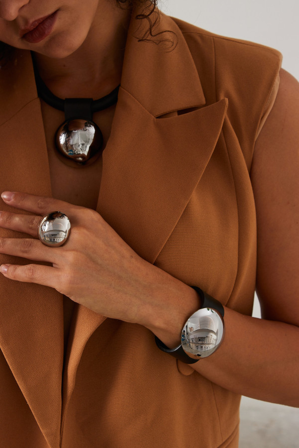 Minimalist stainless steel ring in a geometric half-sphere design with polished silver finish 2