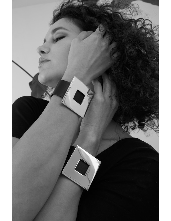 Black women's leather bracelet with a gold-plated square accent and a magnetic gold clasp