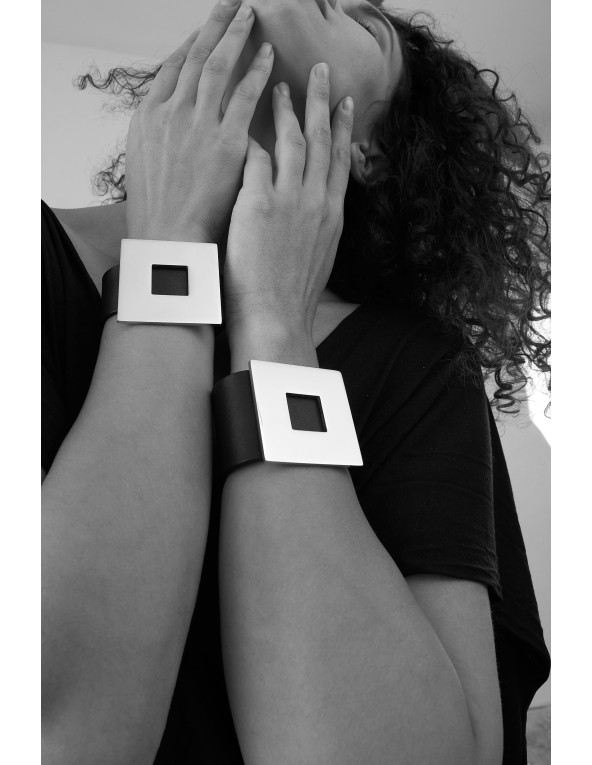 Black wide women's leather bracelet with a gold-plated square accent and magnetic clasp