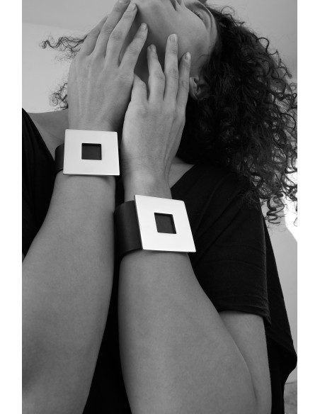 Black wide women's leather bracelet with a gold-plated square accent and magnetic clasp