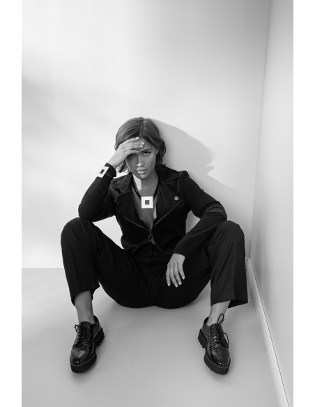 Leather necklace with glossy gold square stainless steel pendant by Moora.