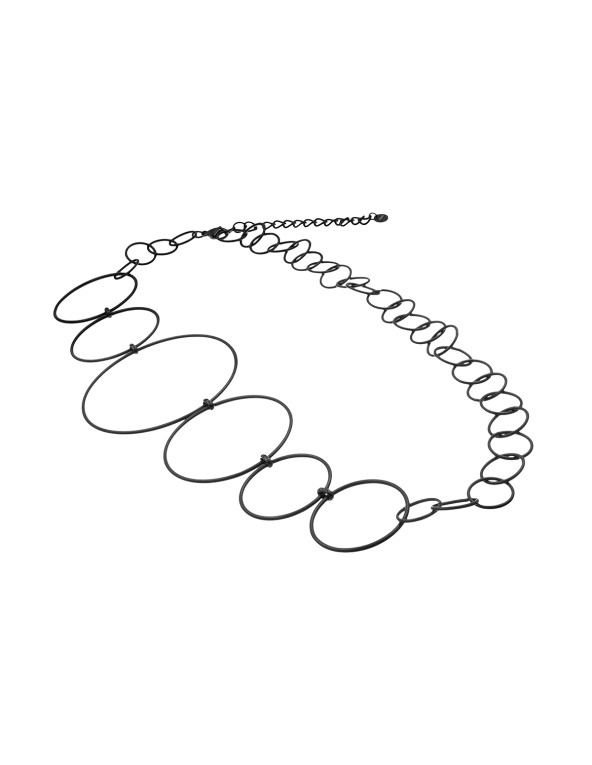 Long matte black stainless steel necklace made of interconnected circles in various sizes.