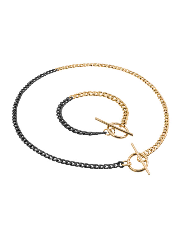 Delicate stainless steel necklace in gold and matte black with a decorative clasp.