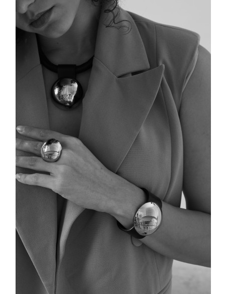 Leather choker with gold-plated stainless steel and glossy sphere in a modern, elegant design.