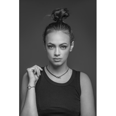 Delicate stainless steel necklace in steel and matte black shades with a decorative clasp. 2