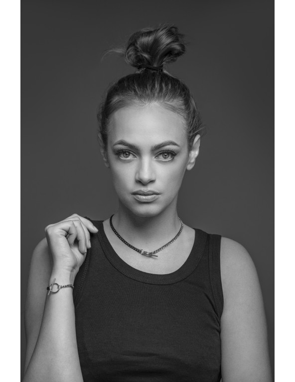 Delicate stainless steel necklace in steel and matte black shades with a decorative clasp.