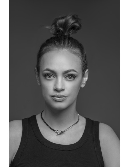 Delicate stainless steel necklace in steel and matte black shades with a decorative clasp.