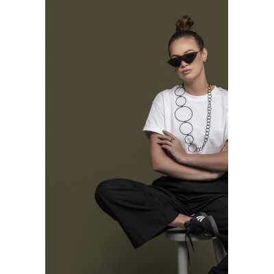 Long matte black stainless steel necklace made of interconnected circles in various sizes. 2