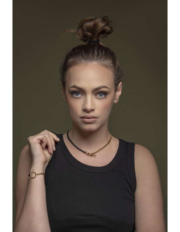 Stainless steel curb chain bracelet in gold and matte black shades with 4 mm width.