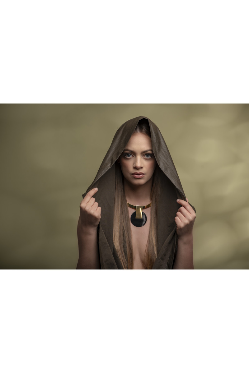 Gold-plated stainless steel choker with decorative pendant in a modern, minimalist style.