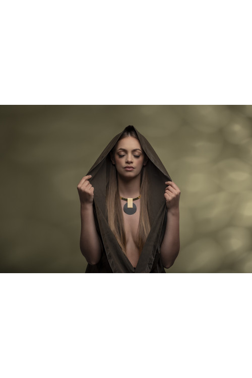 Gold-plated stainless steel choker with decorative pendant in a modern, minimalist style.