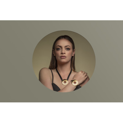 Black leather necklace with large shiny gold-plated stainless steel circular pendant. 2