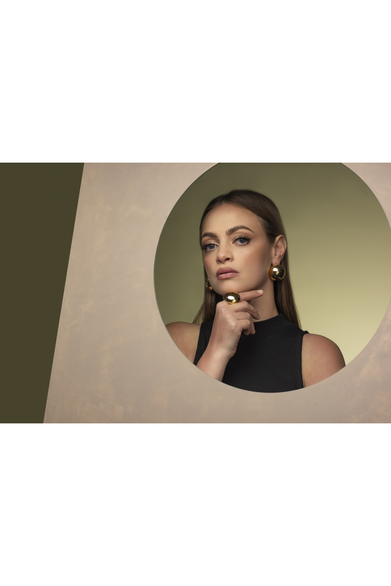 Light gold-plated stainless steel half-sphere earrings in shiny finish.