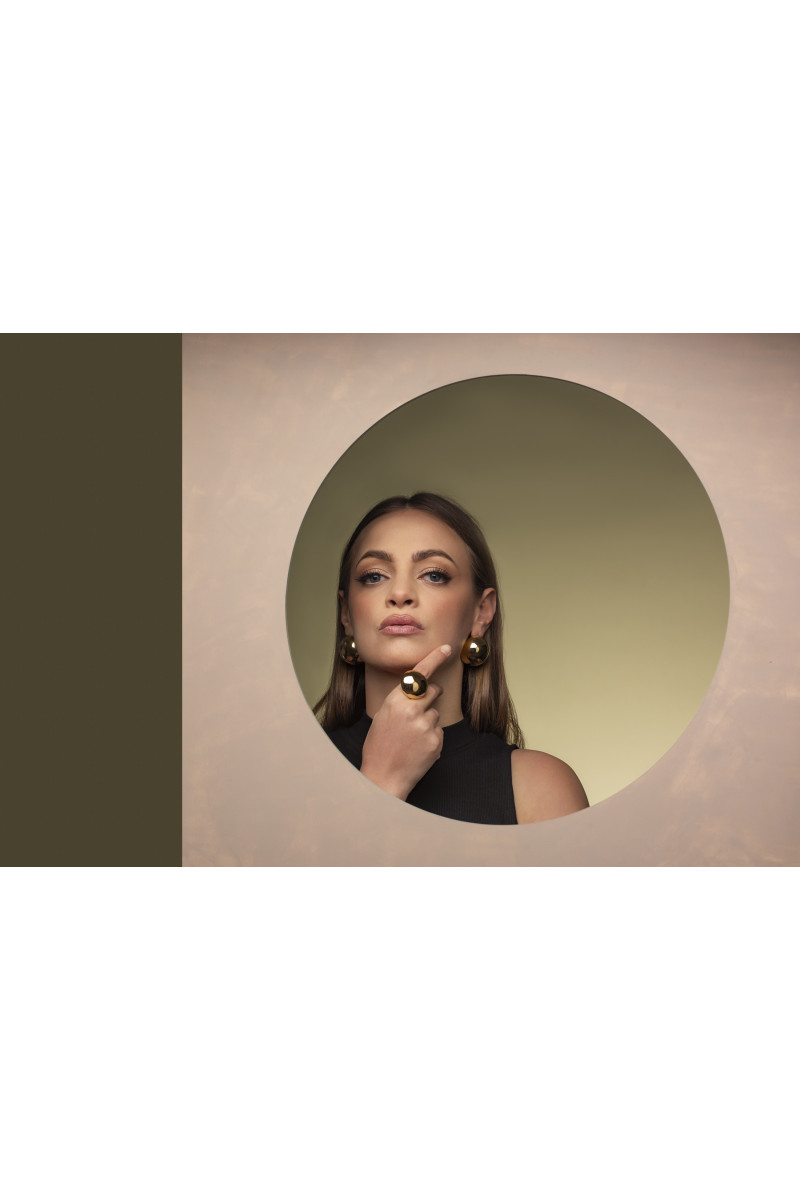 Light gold-plated stainless steel half-sphere earrings in shiny finish.