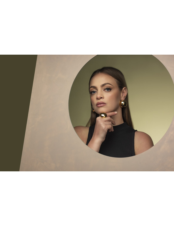 Gold ring with large half-sphere made of stainless steel