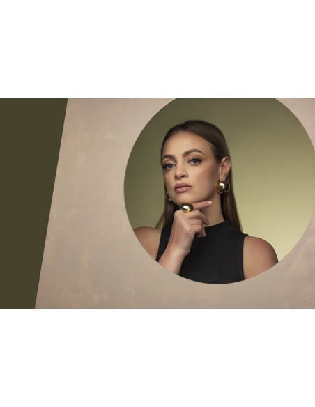 Gold ring with large half-sphere made of stainless steel