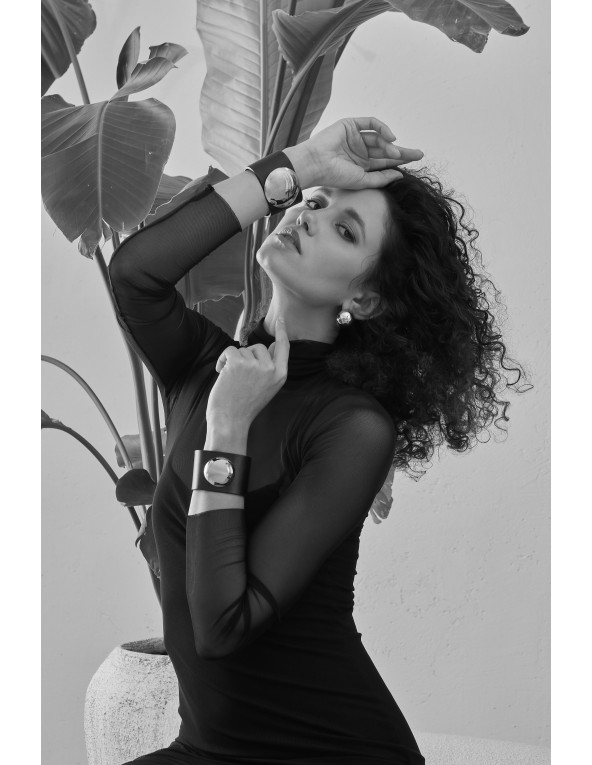 Wide black leather bracelet with gold-plated steel half-sphere and geometric shape