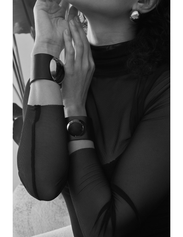 Wide black leather bracelet with large gold stainless steel hemisphere