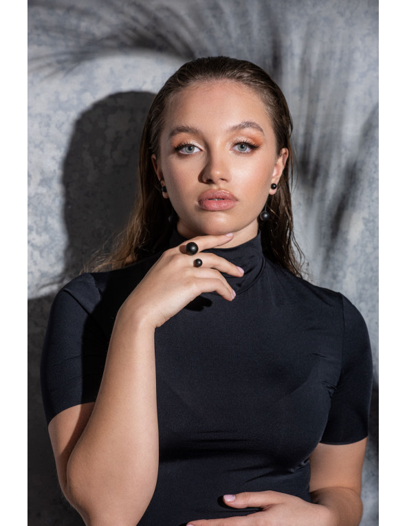 Matte black stainless steel jewelry set with spheres – ring, bracelet, and earrings.