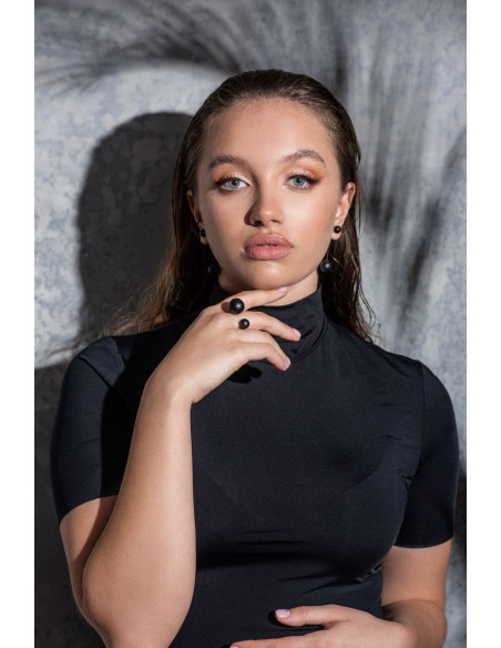 Matte black stainless steel jewelry set with spheres – ring, bracelet, and earrings.