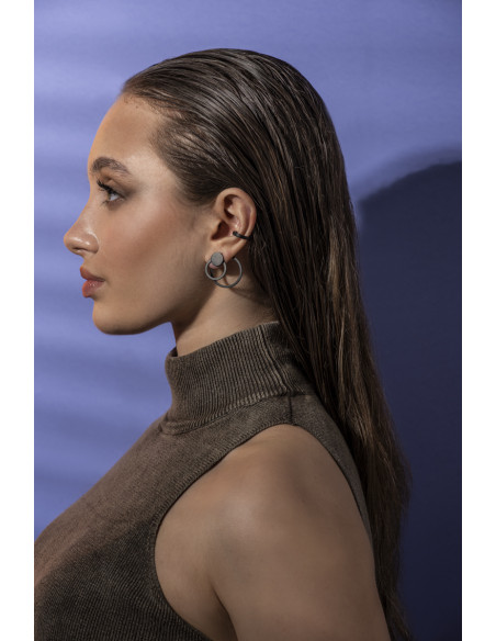 3-in-1 matte black stainless steel earring set with open and closed circle design.