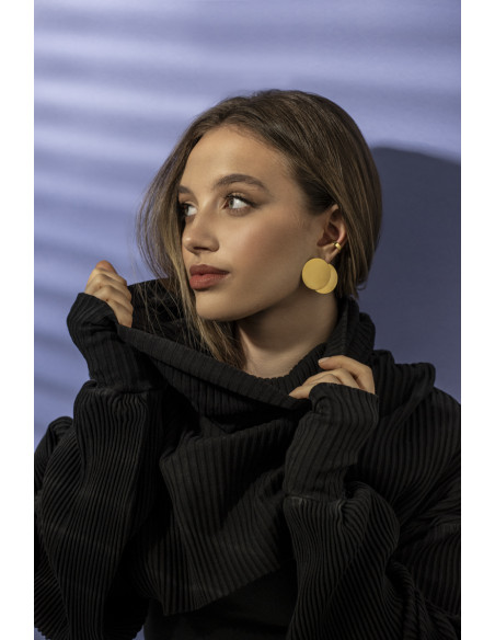 Gold stainless steel disc hoop earrings with a shiny finish and modern minimalist style.