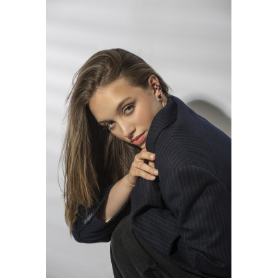 Matte black stainless steel disc earrings with a minimalist round design. 2