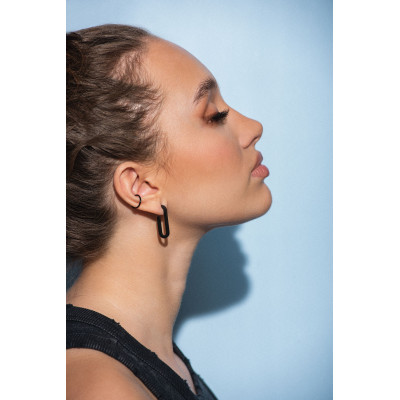 Matte black stainless steel ear cuff with a sleek modern finish. 2