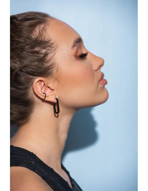 Matte black stainless steel ear cuff with a sleek modern finish.