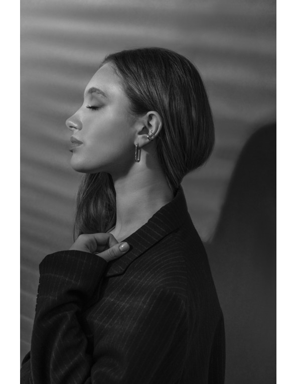 Silver stainless steel ear cuff with a polished finish.