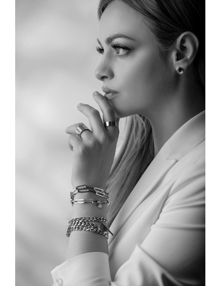 Silver stainless steel bracelet with large links wrapped three times around the wrist