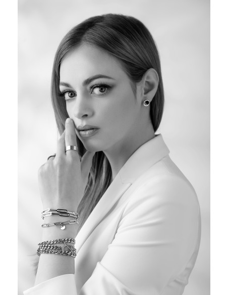 Silver stainless steel bracelet with large links wrapped three times around the wrist