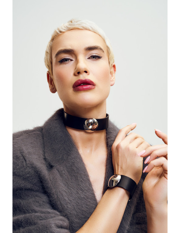 Black leather bracelet with wide polished steel element and classic design