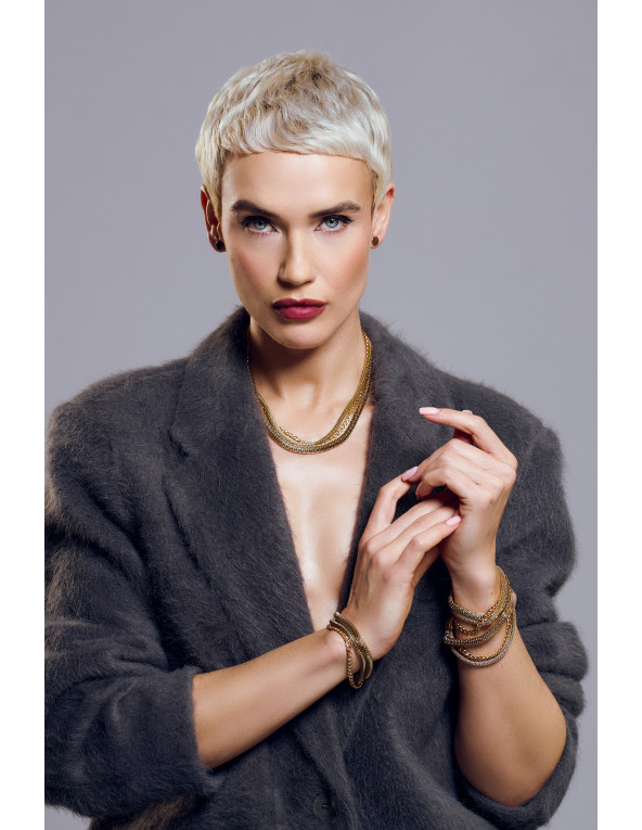 Gold stainless steel choker necklace made of three interlinked chains.