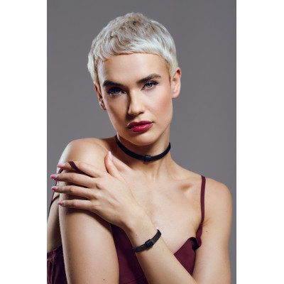 Black matte stainless steel bracelet with a delicate design detail. 2