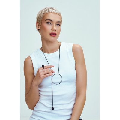 Matte black long stainless steel necklace with a modern minimalist finish. 2