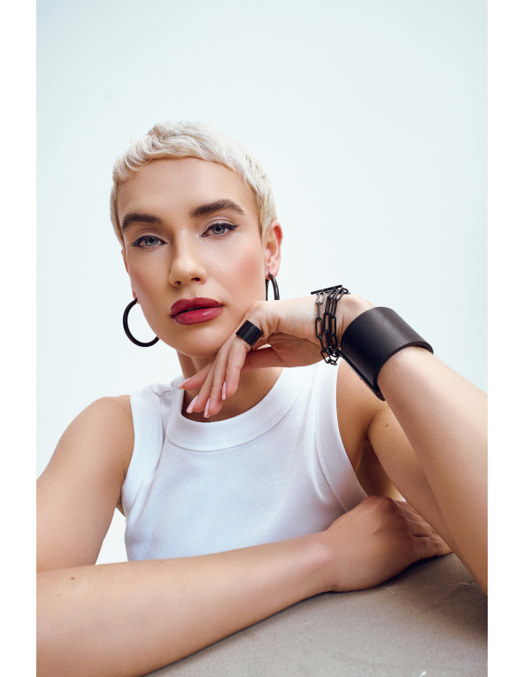 Large black matte stainless steel hoop earrings with a timeless and elegant design.