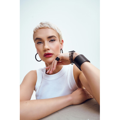 Black matte stainless steel bracelet with large links wrapped three times around the wrist 2