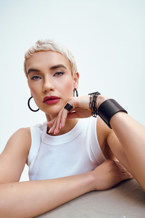 Black matte stainless steel bracelet with large links wrapped three times around the wrist