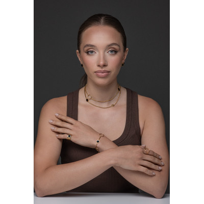 Women's gold signet ring made of matte stainless steel with a shiny black stone 2