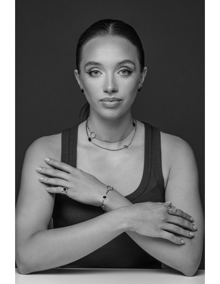 Women's silver signet ring made of brushed stainless steel with a glossy black accent