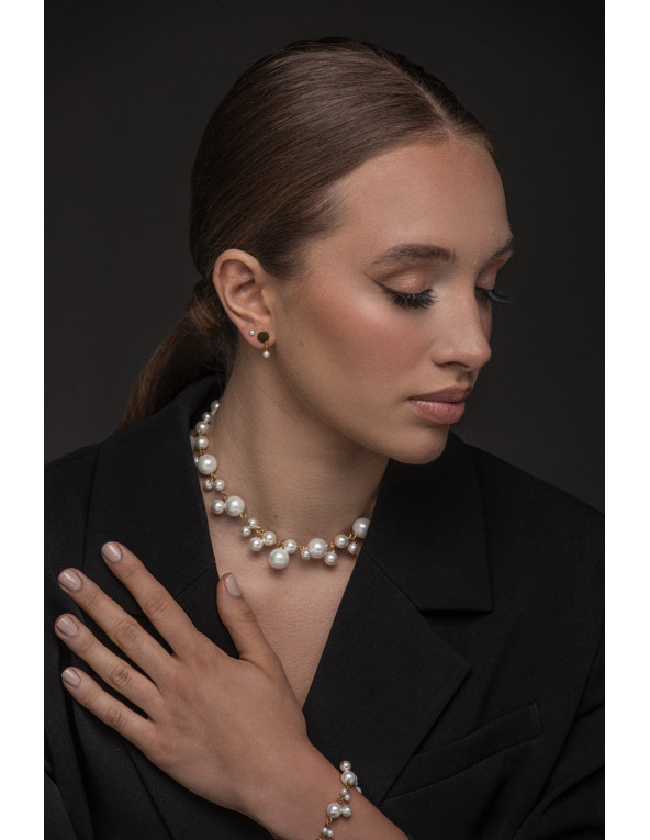 Gold-plated shell pearl necklace displayed with elegant packaging