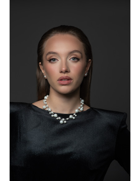 Gold-plated shell pearl necklace displayed with elegant packaging