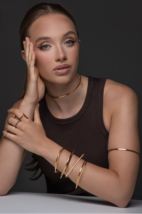 Gold stainless steel arm cuff with minimalist elegant design