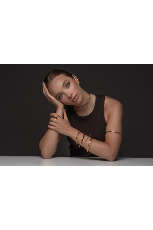 Gold stainless steel arm cuff with minimalist elegant design
