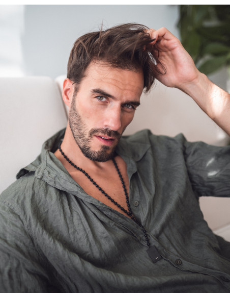 Men's long necklace of matte onyx stones with a black pendant for engraving.