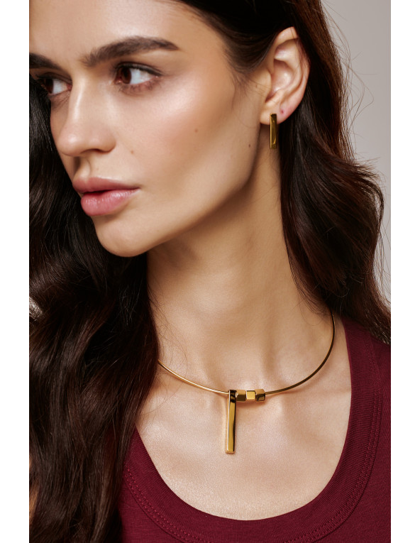 A gold-plated rigid necklace with delicate charms
