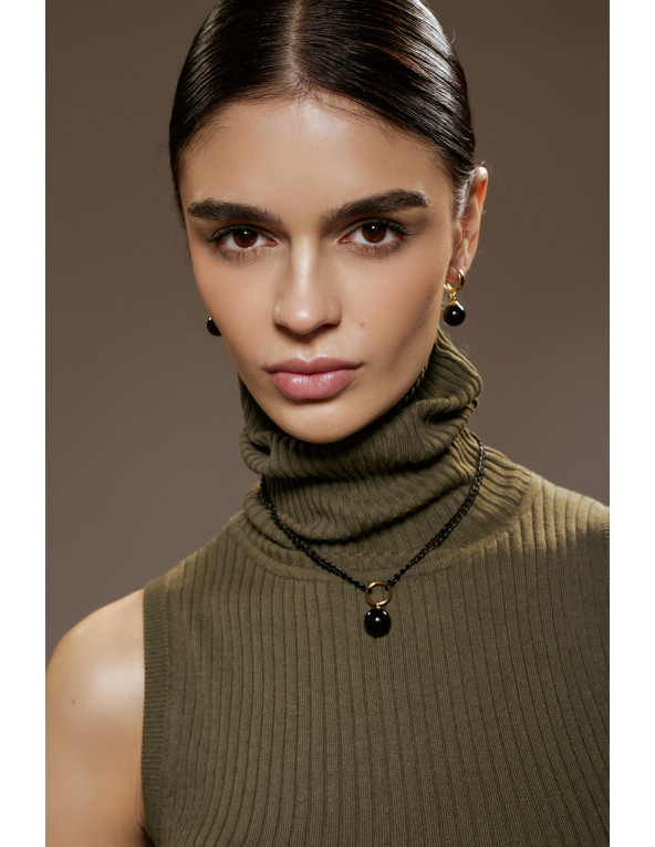 Gold-plated silver earrings with large black onyx stones on a white background.